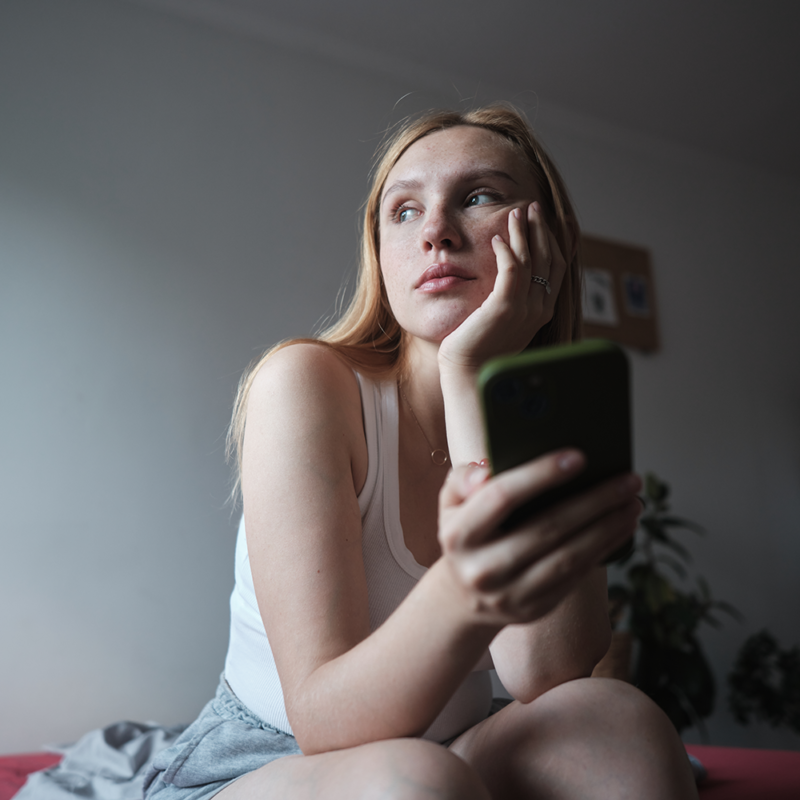 sad woman with phone